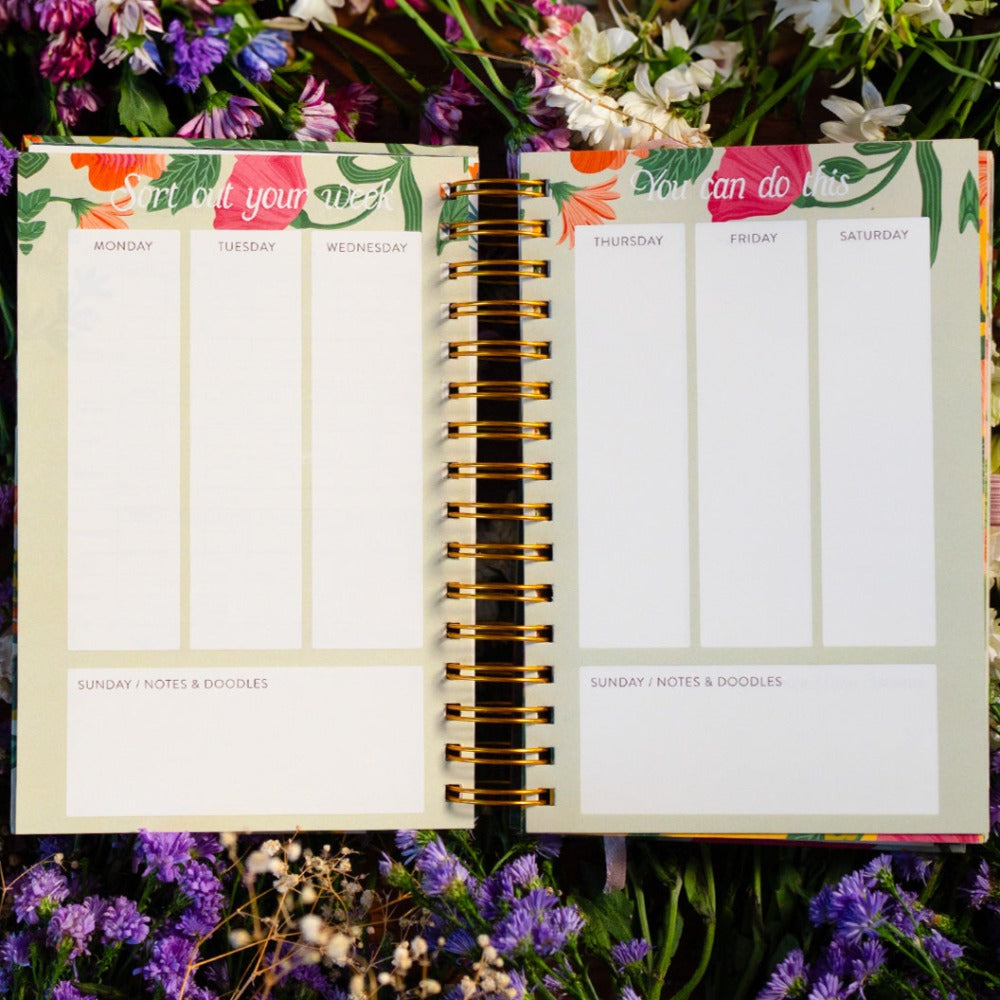 Elegant floral undated planner with wire binding.