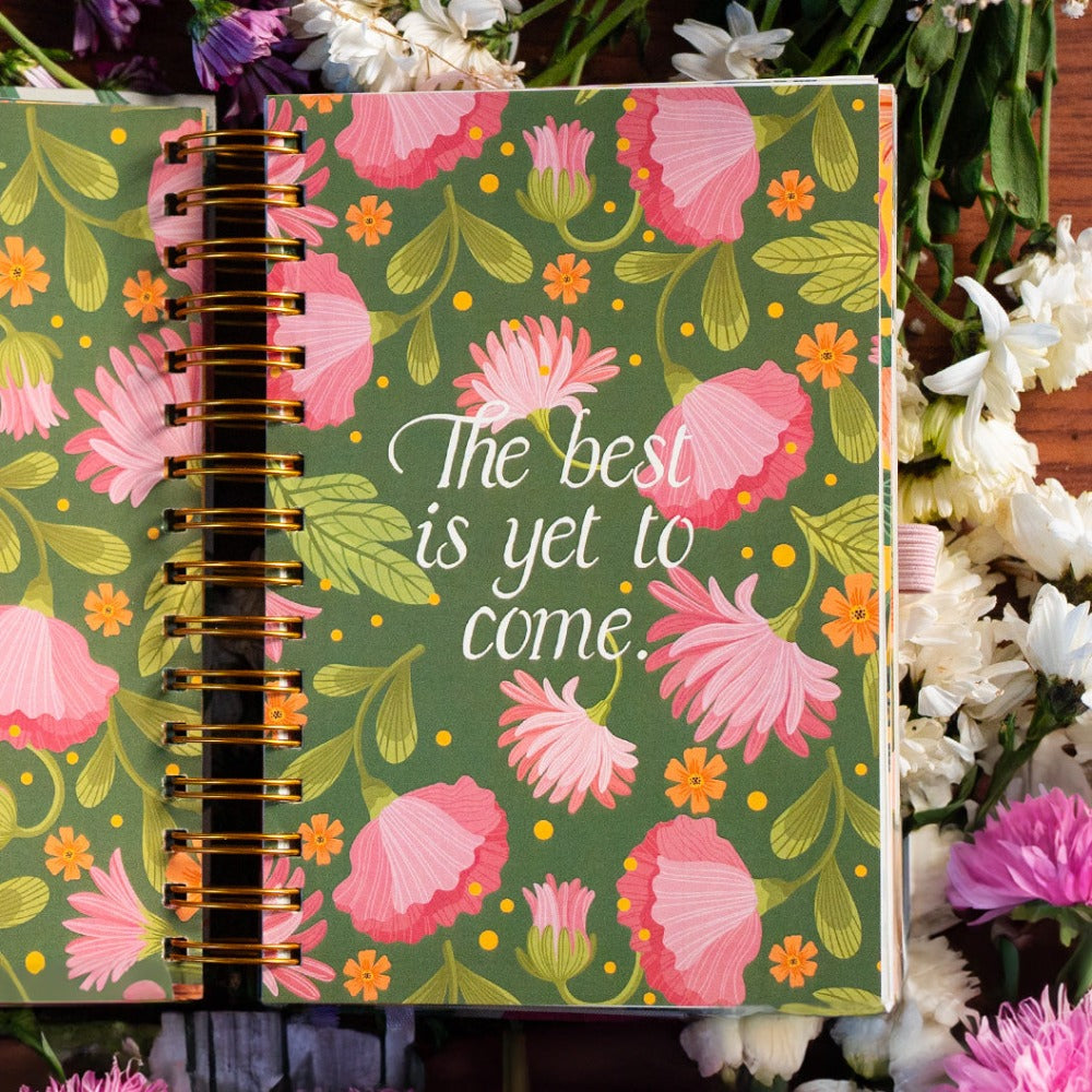 Spiral-bound undated planner with beautiful flowers.